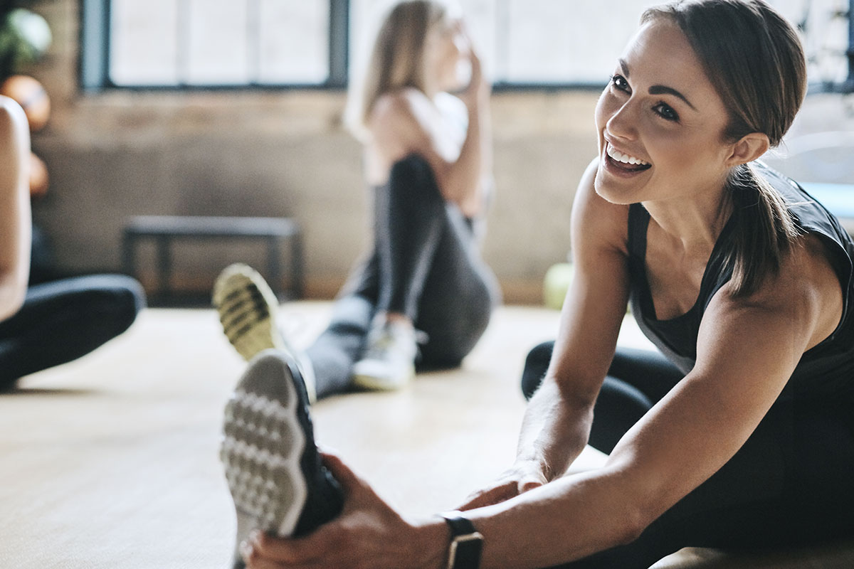 woman stretching in class after Alpha Performance in Tulsa